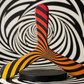 Boomerang tripale Spirale en bois, rayures noires et dégradé rouge orange jaune
